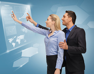 Image showing man and woman working with virtual touch screens