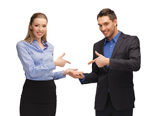 Image showing man and woman making a gun gesture