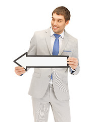 Image showing businessman with direction arrow sign