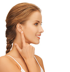 Image showing woman pointing to ear