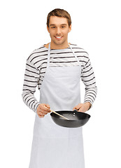 Image showing handsome man with pan and spoon