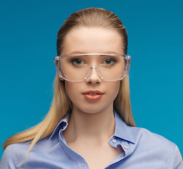 Image showing businesswoman in protective glasses
