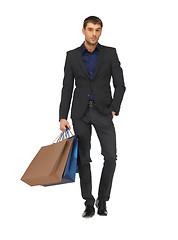 Image showing handsome man in suit with shopping bags