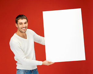 Image showing handsome man with big blank board