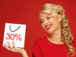 Image showing lovely woman in red dress with shopping bag