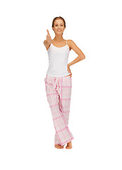 Image showing woman in cotton pajamas showing thumbs up