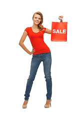 Image showing teenage girl in red t-shirt with shopping bag