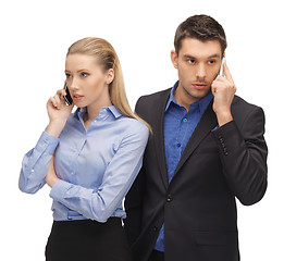 Image showing man and woman with cell phones