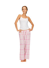 Image showing happy and smiling woman in cotton pajamas