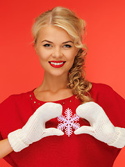 Image showing woman in mittens and red dress with snowflake