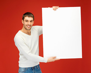 Image showing handsome man with big blank board