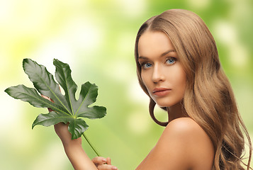 Image showing woman with green leaf