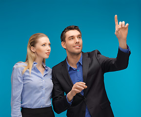 Image showing man and woman working with something imaginary