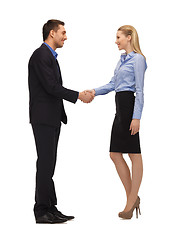 Image showing man and woman shaking their hands