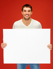 Image showing handsome man with big blank board