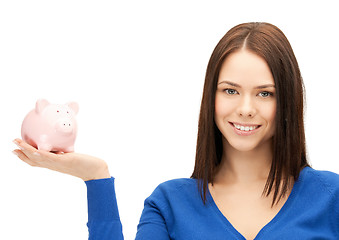 Image showing lovely woman with piggy bank