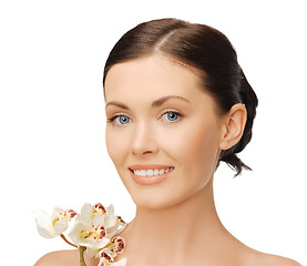 Image showing lovely woman with orchid flower