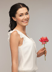 Image showing young and beautiful woman with flower