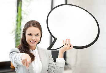 Image showing smiling businesswoman with blank text bubble