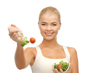 Image showing healthy woman holding bowl with salad