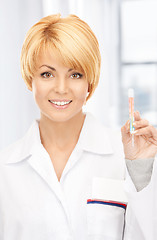 Image showing attractive female doctor with thermometer