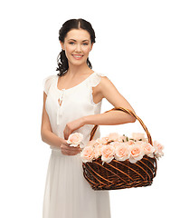 Image showing woman with basket full of flowers