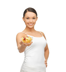 Image showing healthy woman holding bowl with fruit salad