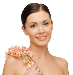 Image showing lovely woman with orchid flower