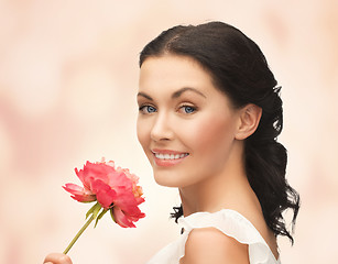 Image showing young and beautiful woman with flower