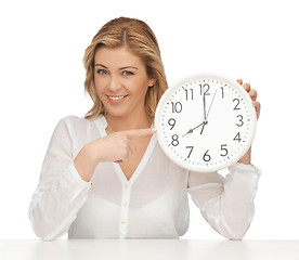 Image showing woman with clock