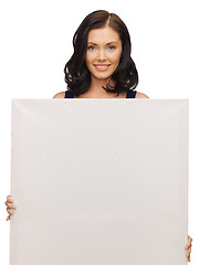 Image showing lovely woman in blue dress with blank board