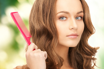 Image showing beautiful woman with comb