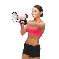 Image showing woman with megaphone pointing at something