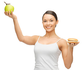 Image showing woman with hamburger and apple