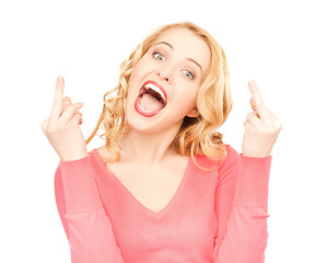 Image showing excited young woman showing middle fingers