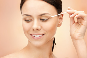 Image showing beautiful woman with cotton bud