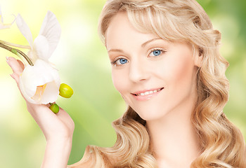 Image showing beautiful woman with orchid flower