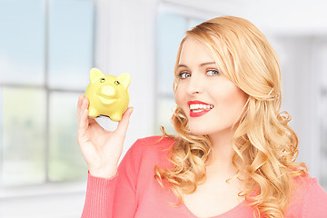 Image showing lovely woman with piggy bank