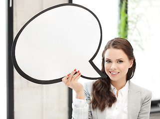 Image showing smiling businesswoman with blank text bubble