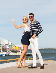 Image showing Couple standing and waving in port