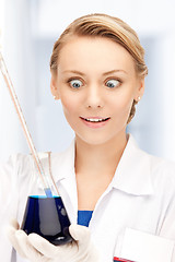 Image showing lab worker holding up test tube