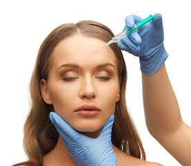 Image showing woman face and beautician hands