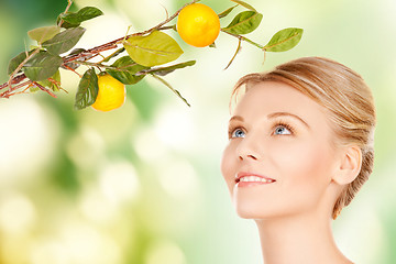 Image showing woman with lemon twig