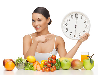 Image showing woman with big clock