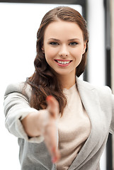 Image showing woman with an open hand ready for handshake