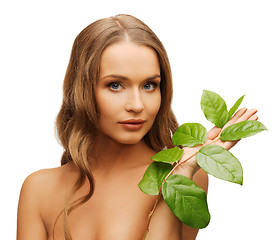 Image showing woman with green leaf