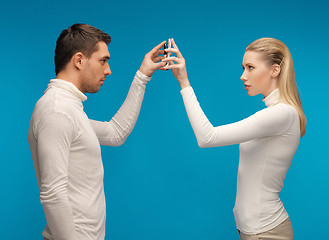 Image showing man and woman with modern gadgets