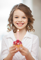 Image showing girl with cupcake