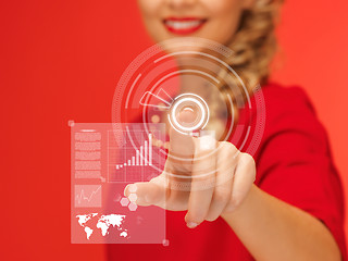 Image showing woman in red dress pressing virtual button