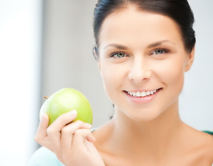 Image showing beautiful woman in the with an apple